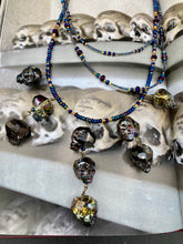 Load image into Gallery viewer, Cascade of Edgy Gun Metal Skulls Glass Beaded Necklace, Pastel Goth Skull Jewelry, Vampire Goth, Dia De Los Muertos Calavera