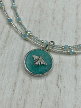 Load image into Gallery viewer, Make a statement with this dainty, yet bold Amazonite Bee Pendant Necklace. Beautifully beaded with frosty glass in blue and silver tones, this shabby chic jewelry piece complements any outfit. The perfect combination of hues and shapes will add complexity and elegance to your look. Measurements: Necklace is 17” in length