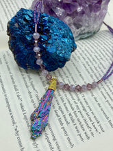 Load image into Gallery viewer, This Rainbow Kyanite Wired Stone Pendant features two strands of glass bead necklaces with a dazzling spectrum of colors, including purple, pink, gold, blue, and green. This bold piece of jewelry is guaranteed to add an eye-catching touch to any collection. Measurements: Necklace is 17” in length, can be adjusted to 18"
