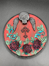 Load image into Gallery viewer, This Memento Mori Wall Art Decor is a one-of-a-kind art piece, skillfully crafted with a black polymer clay skull and wings on a dark red wood frame, decoratively woven with dark red roses and vines. It's perfect for adding an eye-catching touch to any wall and makes a unique, bold gift.  Measurements:  Diameter 6 3/4" x Depth 1 1/2"