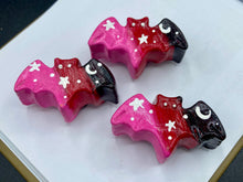 Load image into Gallery viewer, Cute and spooky magnet design to adorn your refrigerator, lockers, workstation, toolbox, or dishwasher. This hand-sculpted clay bat statuette boasts stunning ombre coloration, transitioning from black to dark red to pink to recreate the breathtaking look of a starry night sky. H 1” x W 2” x D 1/2”