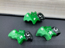 Load image into Gallery viewer, Cute and spooky magnet design to adorn your refrigerator, lockers, workstation, toolbox, or dishwasher. This hand-sculpted clay bat statuette boasts stunning ombre coloration, transitioning from black to dark green to light green to recreate the breathtaking look of a starry night sky. H 1” x W 2” x D 1/2”