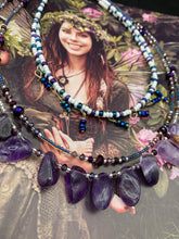 Load image into Gallery viewer, The Genuine Amethyst Natural Gemstone Adjustable Chocker Style Glass Beaded Necklace features vibrant violet and white tones. Its unique draped beading creates a beautiful style with a series of short strands of glass beads for movement and a longer strand with a multitude of amethyst nugget beads. The collar necklace hangs gracefully along the neck and chest, making it a dream come true for violet lovers.  Measurements:  Necklace is 15” in length adjustable to 18" in length
