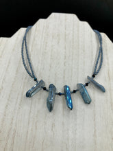 Load image into Gallery viewer, This sophisticated double-strand necklace glitters with silver and gray-tone glass beads, complemented by luminous blue crystal stone nuggets. It gracefully drapes around the neck. Measurements:  Necklace is 15 1/4”adjustable up to 17" in length