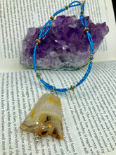 Load image into Gallery viewer, This two-strand necklace features an array of glass beads, including shades of green, blue and turquoise, as well as gold and green. Topped off with a show-stopping yellow agate stone in turquoise, the necklace boasts an eye-catching color combination. Measurements: Necklace is 15 1/2", adjustable up to 17”