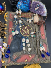 Load image into Gallery viewer, Dangling Skulls With Crosses Earrings, Pastel Goth Skulls And Crosses Jewelry, Dia De Los Muertos Aretes, Day of the Dead Jewelry, Fish Hook
