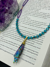 Load image into Gallery viewer, This necklace boasts a stunning Rainbow Kyanite wired stone pendant and two strands of shimmering glass beads. The blues contain hues of pink, gold, blue and green, offering a vibrant and bold addition to any jewelry collection. Measurements: Necklace is 17” in length, can be adjusted to 18"