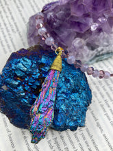 Load image into Gallery viewer, This Rainbow Kyanite Wired Stone Pendant features two strands of glass bead necklaces with a dazzling spectrum of colors, including purple, pink, gold, blue, and green. This bold piece of jewelry is guaranteed to add an eye-catching touch to any collection. Measurements: Necklace is 17” in length, can be adjusted to 18"