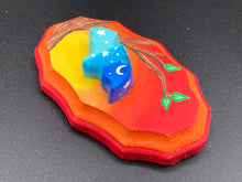 Load image into Gallery viewer, This unique Starry Night Mini Bat Wall Art Decor is hand sculpted and painted in vivid hues to offer an eye-catching decoration for your living space. The bat is painted in a gradient of light to dark blue, and is complemented by white stars and a crescent moon. The wood frame is painted in yellow, orange and red for a stunning sundown effect for a drastic contrast to the blue bat.