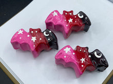 Load image into Gallery viewer, Cute and spooky magnet design to adorn your refrigerator, lockers, workstation, toolbox, or dishwasher. This hand-sculpted clay bat statuette boasts stunning ombre coloration, transitioning from black to dark red to pink to recreate the breathtaking look of a starry night sky. H 1” x W 2” x D 1/2”