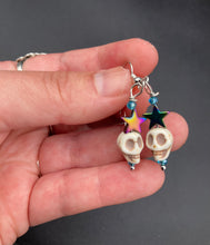 Load image into Gallery viewer, Mini Howlite Skull Bead Earrings, star shaped rainbow hematite beads for a fun pastel goth vibe. Perfect for pastel goth, dark witchy, celestial galaxy stardust, day of the dead jewelry. You can dress these up or down, it will definitely give your outfit a unique look. Measurements: 1 1/2 ” in length