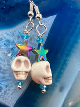 Load image into Gallery viewer, Mini Howlite Skull Bead Earrings, star shaped rainbow hematite beads for a fun pastel goth vibe. Perfect for pastel goth, dark witchy, celestial galaxy stardust, day of the dead jewelry. You can dress these up or down, it will definitely give your outfit a unique look. Measurements: 1 1/2 ” in length