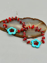 Load image into Gallery viewer, These Bamboo coral red stone chip earrings feature a subtle hoop design adorned with tiny turquoise, red, and gold glass beads. Completing the look is a turquoise flower pendant with a dark red glass bead in the center. Measurements: 2" length
