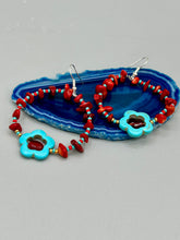 Load image into Gallery viewer, These Bamboo coral red stone chip earrings feature a subtle hoop design adorned with tiny turquoise, red, and gold glass beads. Completing the look is a turquoise flower pendant with a dark red glass bead in the center. Measurements: 2" length