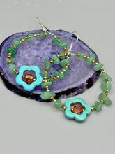Load image into Gallery viewer, Achieve a simple nature look with these aventurine natural stone chip beaded hoop earrings. The green and gold glass beads and turquoise flower pendant with amber-tone glass beads add a bohemian-chic touch to any ensemble. These earrings are perfect for any free-spirited occasion. Measurements: 2 1/4" length