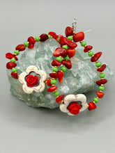 Load image into Gallery viewer, These bamboo coral red stone chip beaded hoop earrings feature green and gold glass, while a white magnesite flower pendant and quartzite rose beads add detail. Measurements: 3" length