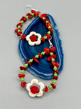 Load image into Gallery viewer, These bamboo coral red stone chip beaded hoop earrings feature green and gold glass, while a white magnesite flower pendant and quartzite rose beads add detail. Measurements: 3" length