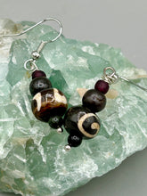 Load image into Gallery viewer, Mismatched round bone beads create an adaptable look when paired with neutral colors and wavy patterns, enabling wearers to tailor their ensembles in whatever way they desire. Measurements: 1 1/2 ” in length