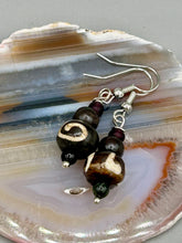 Load image into Gallery viewer, Mismatched round bone beads create an adaptable look when paired with neutral colors and wavy patterns, enabling wearers to tailor their ensembles in whatever way they desire. Measurements: 1 1/2 ” in length