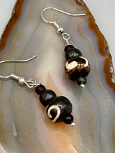 Load image into Gallery viewer, Mismatched round bone beads create an adaptable look when paired with neutral colors and wavy patterns, enabling wearers to tailor their ensembles in whatever way they desire. Measurements: 1 1/2 ” in length