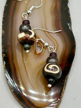 Load image into Gallery viewer, Mismatched round bone beads create an adaptable look when paired with neutral colors and wavy patterns, enabling wearers to tailor their ensembles in whatever way they desire. Measurements: 1 1/2 ” in length