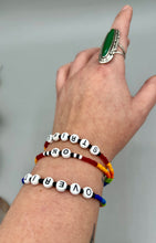 Load image into Gallery viewer, Rainbow Pride beaded bracelet ON STRIKE Metal wire with hook-eye clasp.