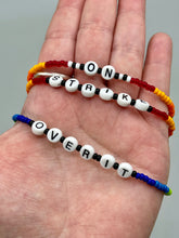 Load image into Gallery viewer, Rainbow Pride beaded bracelet ON STRIKE Metal wire with hook-eye clasp.