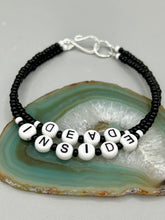 Load image into Gallery viewer, This set of Sarcastic Beaded Bracelets features fun and fashionable accessories perfect for any occasion. Crafted from metal wire and equipped with a hook-eye clasp, these sassy, sarcastic bracelets come in black and white and rainbow style. They are sure to make a statement. A fun addition to any accessory collection. Measurements: Black and White Color "Dead Inside": 8 1/4" in length Rainbow Color "U Suck": 8 1/2” in length
