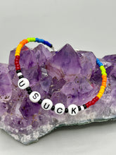 Load image into Gallery viewer, This set of Sarcastic Beaded Bracelets features fun and fashionable accessories perfect for any occasion. Crafted from metal wire and equipped with a hook-eye clasp, these sassy, sarcastic bracelets come in black and white and rainbow style. They are sure to make a statement. A fun addition to any accessory collection. Measurements: Black and White Color "Dead Inside": 8 1/4" in length Rainbow Color "U Suck": 8 1/2” in length