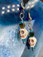 Load image into Gallery viewer, Howlite Skull Beads Earrings With Tiny Star Heat Shaped Rainbow Hematite Bead. Versatile style, pastel goth, celestial stardust, witchy, day of the dead. You can dress these up or down, it will definitely give your outfit a unique look. Measurements: 1 ” in length