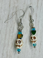 Load image into Gallery viewer, Howlite Skull Beads Earrings With Tiny Star Heat Shaped Rainbow Hematite Bead. Versatile style, pastel goth, celestial stardust, witchy, day of the dead. You can dress these up or down, it will definitely give your outfit a unique look. Measurements: 1 ” in length