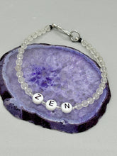 Load image into Gallery viewer, Hand beaded bracelet with clear and silver glass beads, Zen letters Metal wire with hook-eye clasp.