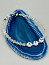Load image into Gallery viewer, Hand beaded bracelet with clear and silver glass beads, Zen letters Metal wire with hook-eye clasp.