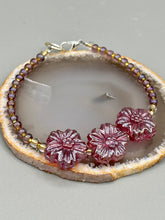 Load image into Gallery viewer, This light purple-pink pressed glass floral beaded bracelet offers delightful detailing with its iridescent shimmer finish. Constructed with metal wire and a lobster claw clasp for secure closure. Measurements: Bracelet: 8" in length