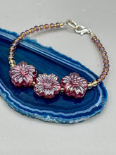 Load image into Gallery viewer, This light purple-pink pressed glass floral beaded bracelet offers delightful detailing with its iridescent shimmer finish. Constructed with metal wire and a lobster claw clasp for secure closure. Measurements: Bracelet: 8" in length