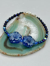 Load image into Gallery viewer, This Dark Blue Violet Pressed Glass Floral Beaded Bracelet features exquisitely detailed components with an iridescent shimmer finish. The piece is crafted with metal wire and a lobster claw clasp.  Measurements:  Bracelet: 8" in length