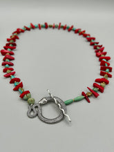 Load image into Gallery viewer, This uniquely designed Southwestern Style necklace is a mesmerizing blend of large bamboo red coral beads as well as turquoise and gold glass beads. The finishing touch is a beautiful large serpent toggle clasp. Measurements: Necklace is 25 1/2 " in length