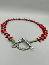 Load image into Gallery viewer, This uniquely designed Southwestern Style necklace is a mesmerizing blend of large bamboo red coral beads as well as turquoise and gold glass beads. The finishing touch is a beautiful large serpent toggle clasp. Measurements: Necklace is 25 1/2 " in length