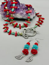 Load image into Gallery viewer, Alluring and enchanting southwest inspired dainty set of earrings captures the beauty of the desert full of blue turquoise and bright red colors, highly detailed and vibrant quartize rose beads and intricate silver plated leaf gives a fun movement. Perfect for you southwest nature lovers, Dia De Los Muertos. You can dress these up or down, it will definitely give your outfit a unique look. Measurements: 2 1/2” in length