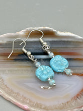 Load image into Gallery viewer, These light blue pressed glass floral beaded earrings feature a fish hook-style closure for a secure fit. Earrings: 1 1/4" length