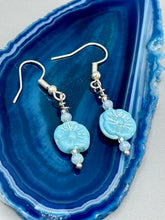 Load image into Gallery viewer, These light blue pressed glass floral beaded earrings feature a fish hook-style closure for a secure fit. Earrings: 1 1/4" length