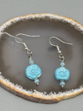 Load image into Gallery viewer, These light blue pressed glass floral beaded earrings feature a fish hook-style closure for a secure fit. Earrings: 1 1/4" length