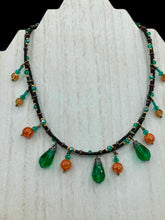 Load image into Gallery viewer, This necklace is the perfect addition to any collection, boasting a dark, elegant aesthetic inspired by nature. Comprised of two strands of glass beads with a variety of shapes and colors, it offers subtle autumnal vibrancy with its orange and green pumpkin-shaped glass beads. This piece is full of shimmer and complexity, providing unique depth and flair. Necklace is 16 1/2” in length, can be adjusted up to 18 1/2"