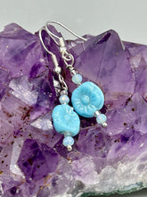 Load image into Gallery viewer, These light blue pressed glass floral beaded earrings feature a fish hook-style closure for a secure fit. Earrings: 1 1/4" length