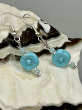 Load image into Gallery viewer, These light blue pressed glass floral beaded earrings feature a fish hook-style closure for a secure fit. Earrings: 1 1/4" length