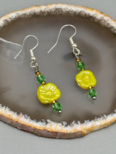 Load image into Gallery viewer, This delicate jewelry displays an array of gentle hues, vibrant yet soft.This light yellow pressed glass floral beaded bracelet and earrings set features an iridescent shimmer finish and is crafted with metal wire and a lobster claw clasp for easy closure. Measurements: Bracelet: 8 1/2" in length Earrings: 1 1/4" length