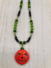 Load image into Gallery viewer, All Hallows Eve Pumpkin Necklace, Dark Souls Goth Necklace, Trick Or Treat, Halloween Spirit Costume Jewelry, Jack O Lantern PendantThis 25mm bright orange pumpkin bead pendant necklace is a perfect complement to any Halloween ensemble. It is additionally enhanced by shimmery glass beads in classic Halloween hues, such as black, dark green, and light green. Measurements: Necklace is 19”