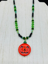 Load image into Gallery viewer, All Hallows Eve Pumpkin Necklace, Dark Souls Goth Necklace, Trick Or Treat, Halloween Spirit Costume Jewelry, Jack O Lantern PendantThis 25mm bright orange pumpkin bead pendant necklace is a perfect complement to any Halloween ensemble. It is additionally enhanced by shimmery glass beads in classic Halloween hues, such as black, dark green, and light green. Measurements: Necklace is 19”