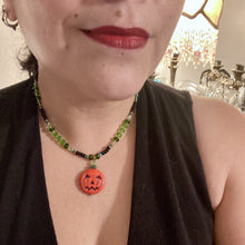 Load image into Gallery viewer, All Hallows Eve Pumpkin Necklace, Dark Souls Goth Necklace, Trick Or Treat, Halloween Spirit Costume Jewelry, Jack O Lantern PendantThis 25mm bright orange pumpkin bead pendant necklace is a perfect complement to any Halloween ensemble. It is additionally enhanced by shimmery glass beads in classic Halloween hues, such as black, dark green, and light green. Measurements: Necklace is 19”