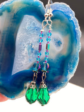 Load image into Gallery viewer, Created with Nature in Mind - Peacock Feathers Inspire These Earrings. Showcase a unique combination of glass beading and rectangular rainbow Hematite beads for a multi-textured look. An eye-catching style and a "must have" for any jewelry collection. Measurements: 2 1/2” in length